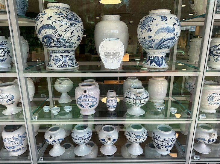 English delftware pots on shelves