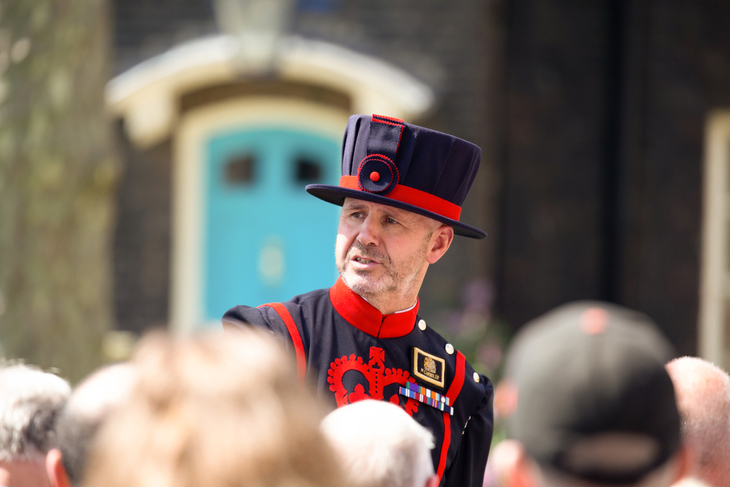 A beefeater addressing a crowd