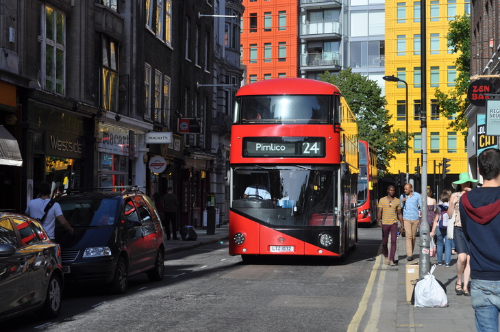 A bus drives down Denmark Street